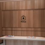 Modern Apple store pickup counter featuring a sleek wooden interior design