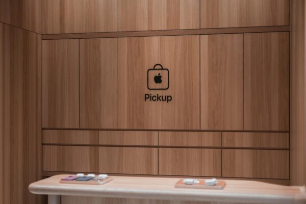Modern Apple store pickup counter featuring a sleek wooden interior design