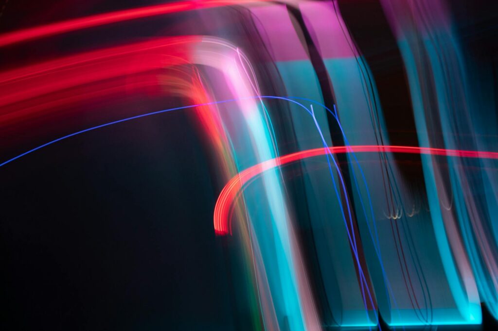 Dynamic and colorful long exposure light streaks in an abstract artistic composition.
