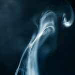 A captivating abstract image of swirling smoke against a dark background.