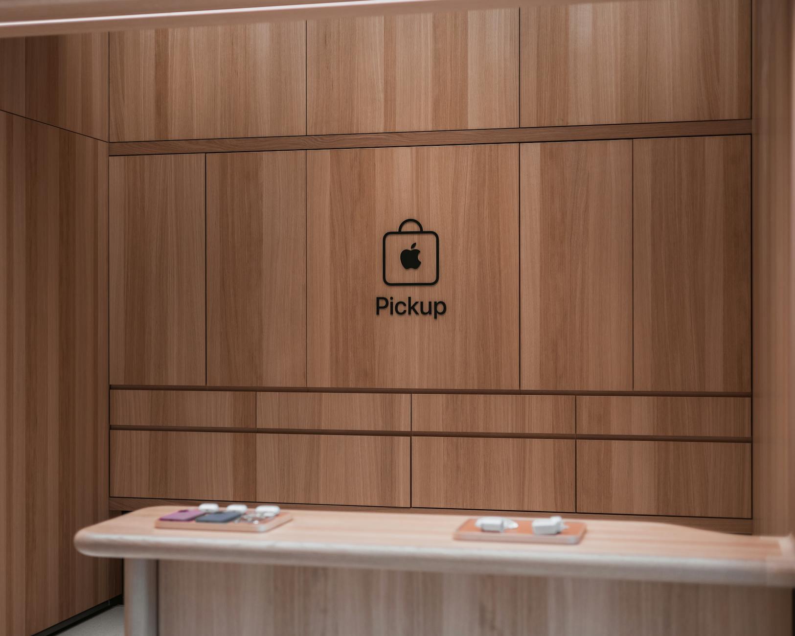 Modern Apple store pickup counter featuring a sleek wooden interior design
