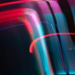 Dynamic and colorful long exposure light streaks in an abstract artistic composition.